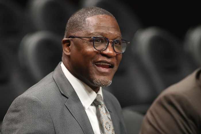 Mar 9, 2020; Atlanta, Georgia, USA; NBA Hall of Fame player Dominique Wilkins talks with Atlanta Hawks staff before the Hawks' game against the Charlotte Hornets at State Farm Arena.